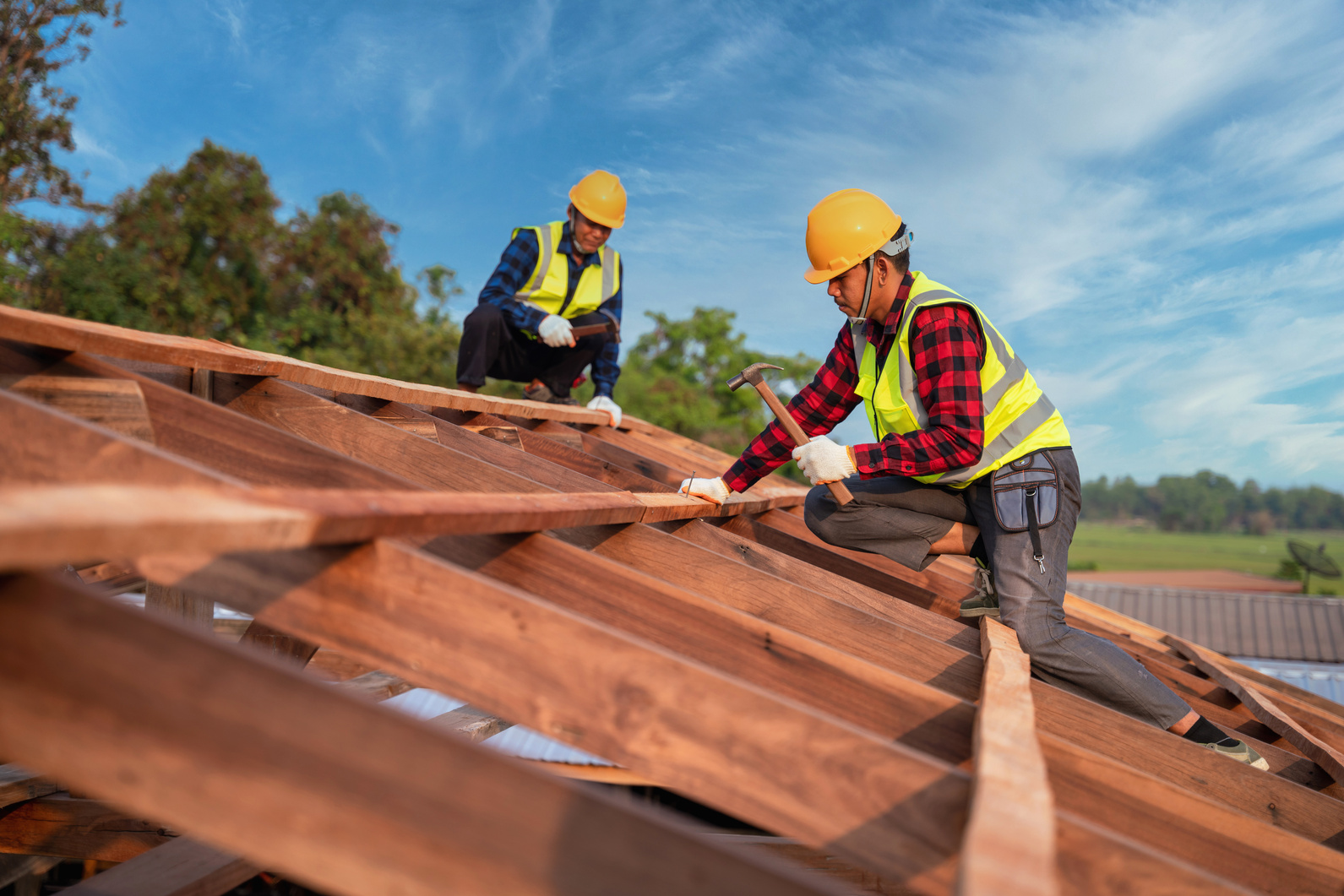 Roofer, Two roofer carpenter working on roof structure on co